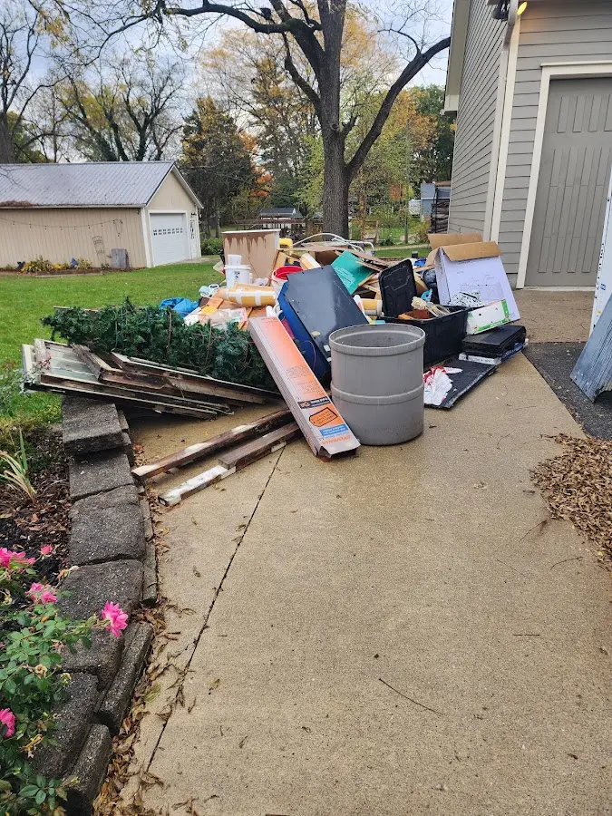 Dumpster being loaded with debris for Roofing Dumpster Rental in Maugansville